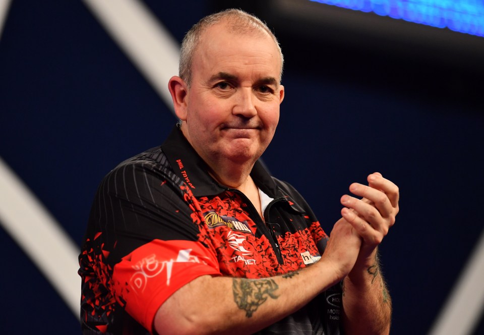 Phil Taylor celebrates winning the PDC World Darts Championship semi-final.
