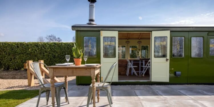 The one-of-a-kind stay inside a train carriage with its own 'station'
