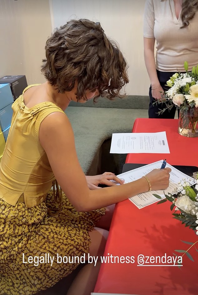 A social media video shared by production company A24 showed Zendaya signing paperwork as a legal witness to the couple's vows