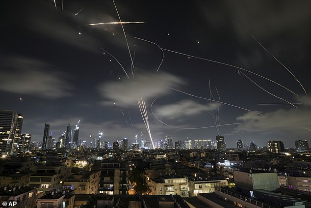 A billion pounds has been allocated to explore air defence options, but that is just a tenth of what ministers have called for. Pictured: The Israeli Iron Dome air defense system fires to intercept missiles during an Iranian attack over Tel Aviv, Israel, on June 18, 2025