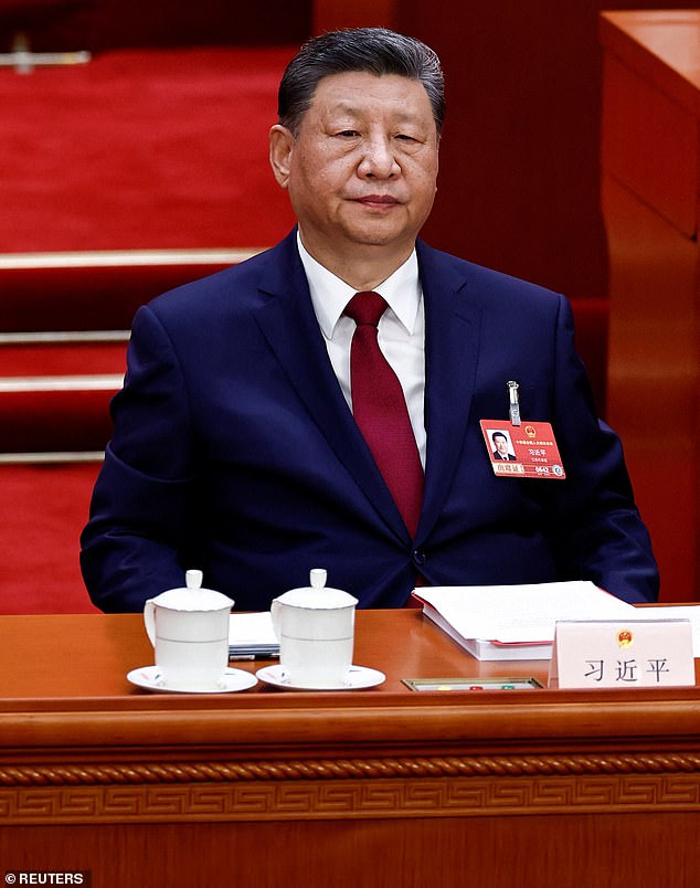 Chinese President Xi Jinping attends the closing session of the National People's Congress (NPC) at the Great Hall of the People in Beijing