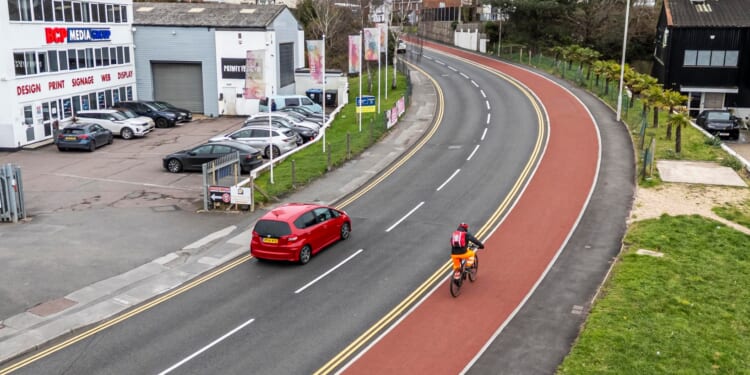 Fury as 11ft wide cycle lane costing £17m opens & is BROADER than busy road it runs alongside causing huge traffic jams