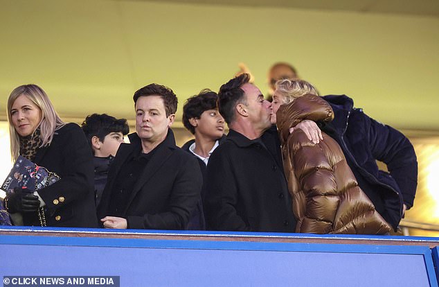 The group were all seen cheering and clapping as the match ended before later heading out of the stands