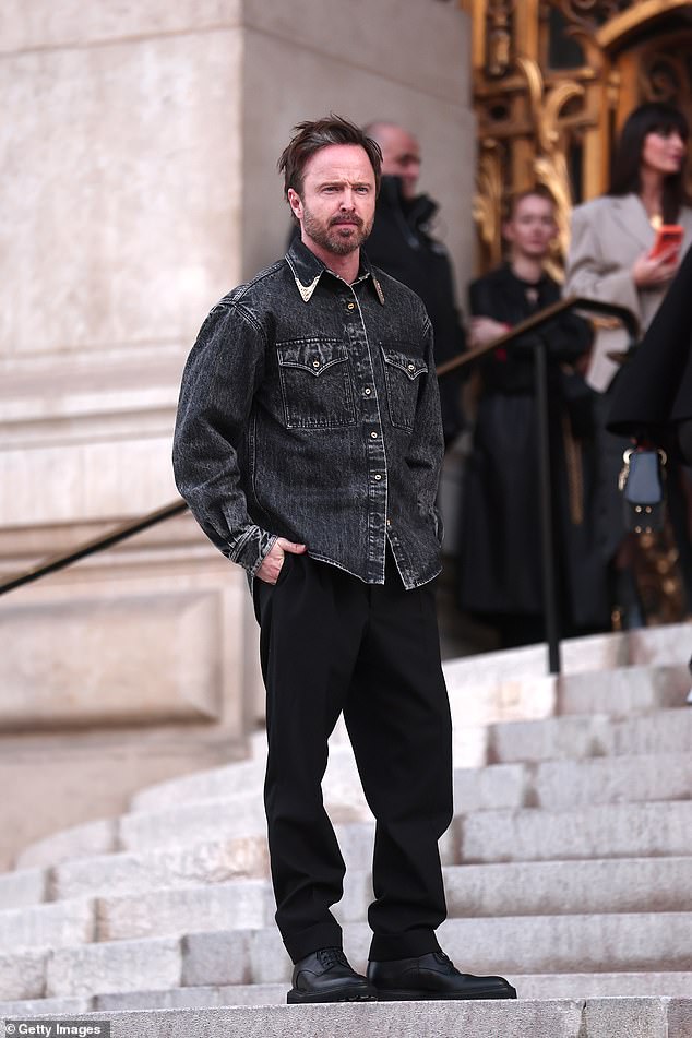 Aaron Paul quit Los Angeles in November as he exclusively revealed to the Daily Mail that he, his wife Lauren and their two young children have relocated to Paris (pictured during 2026 Paris Fashion Week)