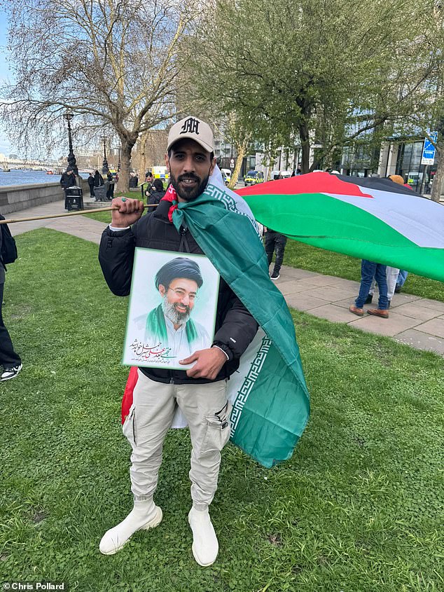 Mohammad, 29, originally from Iraq, brandished a picture of Mojtaba Khamenei and told the Daily Mail he supports the regime because 'of what happened to us in Iraq'