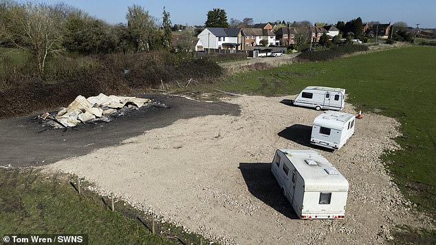 Unbeknown to locals and the former owner, a traveller family bought the plot last year and on February 28 three caravans, a mobile home and lorries moved onto the site (pictured)