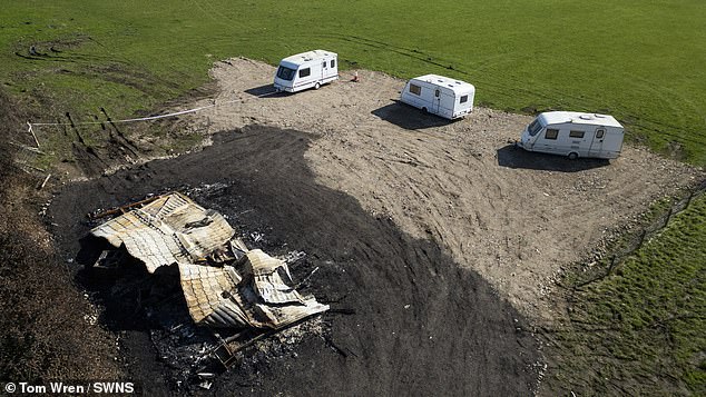 But Mr Cook said a static home was delivered to the site 'hours' after the stop notice: 'The next morning it was in ashes. Who did it, I do not know'. Pictured: The burnt-out remains of the static home