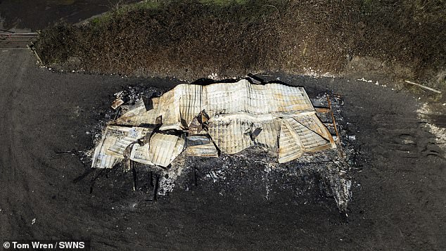 A member of the traveller family, who would only give his surname as Doran, admitted it was his father who moved the static home on to the site, but denied any intention to blackmail villagers. Pictured: The burnt-out remains of the static home