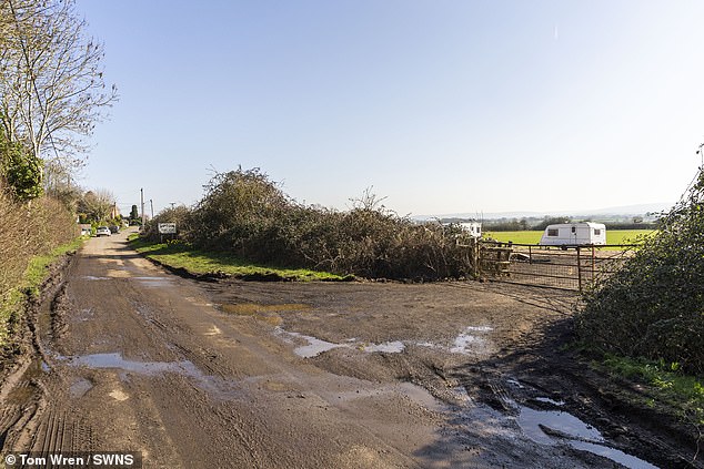 The man said he had a 'suspicion' a villager may have burnt down the static home and said his community were facing discrimination due to their traveller heritage. Pictured: The site