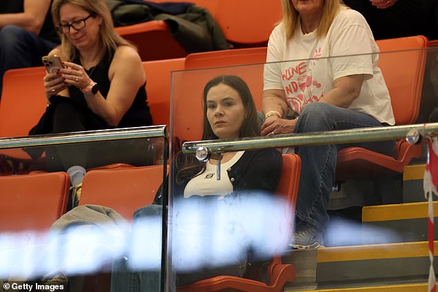 The influencer, 26, was there to support the Olympic swimmer as he took to the pool on the third day of the International Swim Meet
