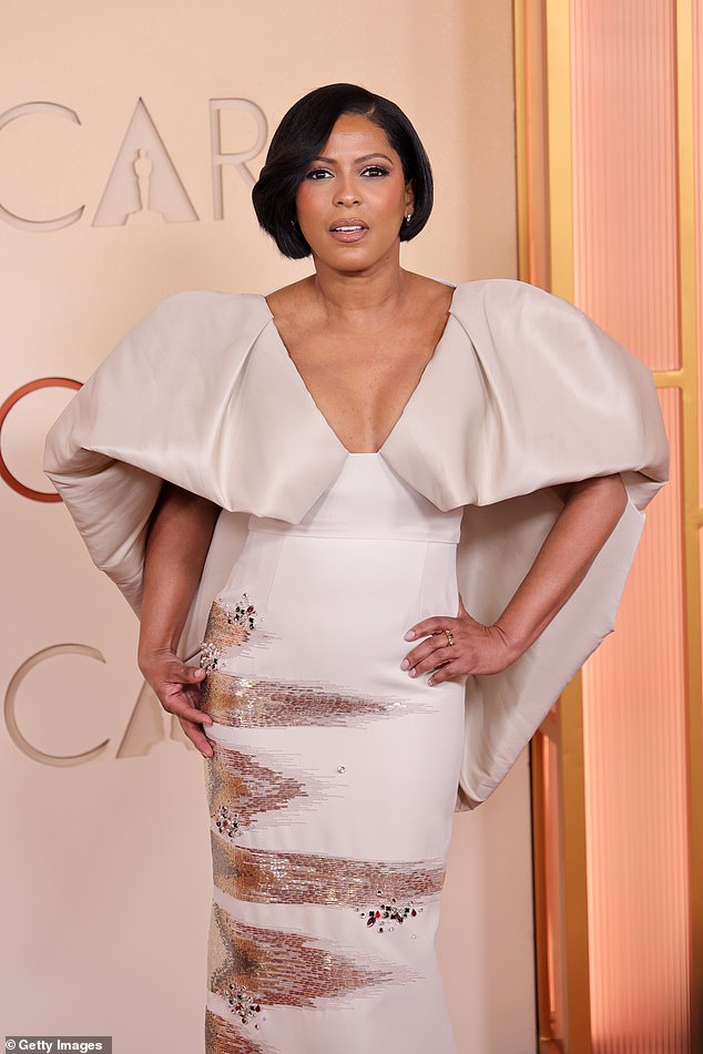 She wowed in a gown featuring dramatic wing-like sleeves and shimmering metallic embellishments