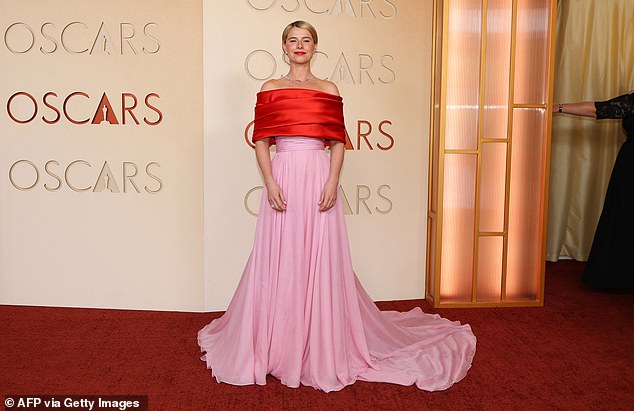 Jessie's off-the-shoulder gown boasted a flowing pale pink train as she made a glamorous arrival on the red carpet