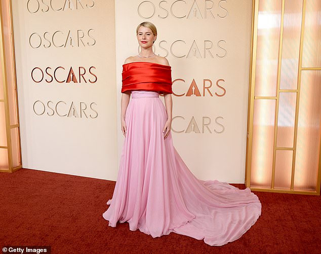 Joining UK favourites on the red carpet, Jessie put on a showstopping display in a elegant red and pink satin gown