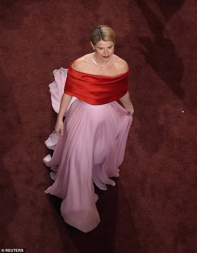 The awards hopeful made her glamorous arrival in her form-fitting red and pink gown