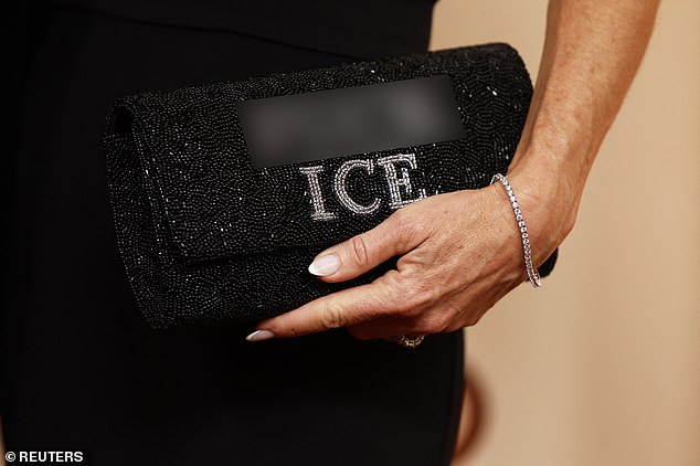 Glennon Doyle's clutch is seen here with the political message emblazoned over the top of it