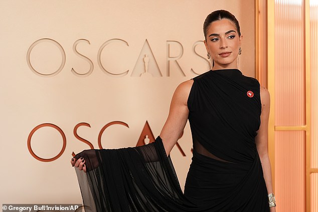 Saja Kilani is seen here wearing the Artists4Ceasefire on her black gown