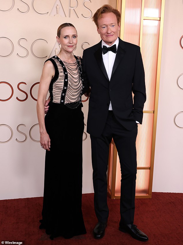 Host Conan O'Brien's wife Liza Powel O'Brien also looked particularly thin this year, as she stood by her husband, who is hosting te program. She showed off her figure in a chain-mail style dress