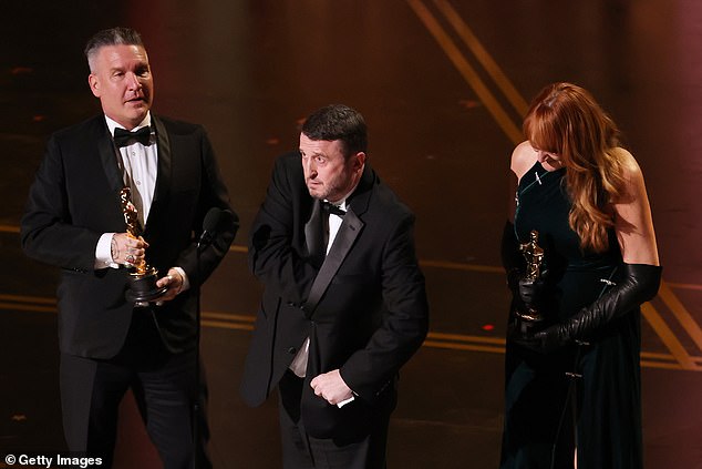 Kate Hawley accepted the costume award while Jordan Samuel, Mike Hill, and Cliona Furey (pictured left to right)  took home the one for makeup and hair