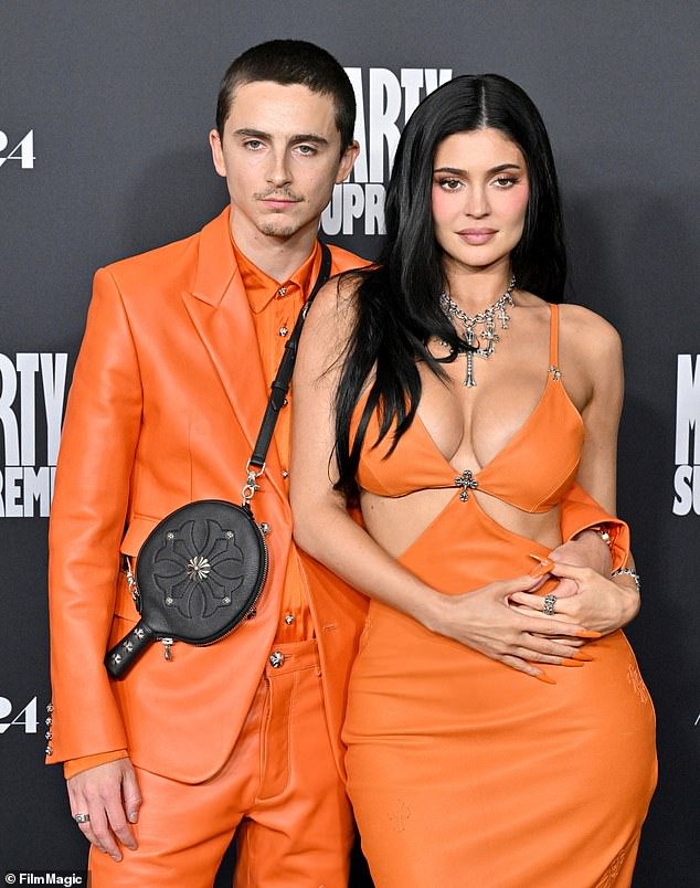 Chalamet is nominated for Best Actor tonight for his role in Marty Supreme. He wore a matching orange ensemble with his girlfriend at the film's Los Angeles premiere