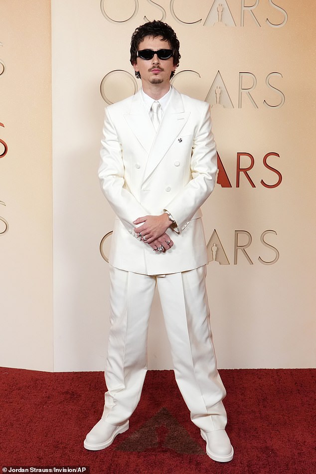 Chalamet walked the red carpet without Jenner in an all-white outfit