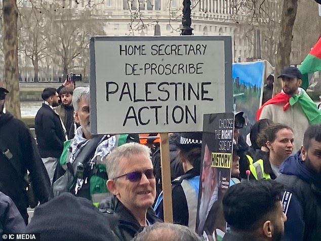 Pro-Iran demonstrators held signs which read 'Home Secretary, de-prescribe Palestine Action'