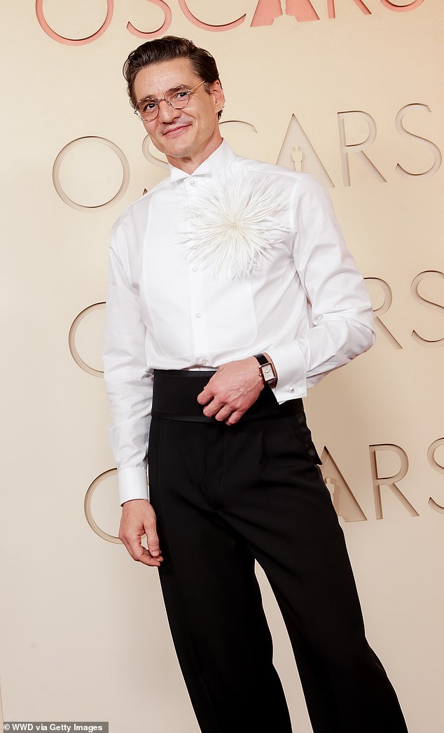 The actor, 50, looked dapper as he hit the red carpet on Sunday evening in a button-down white shirt that contained a big flower on the shoulder and some high-waisted black pants