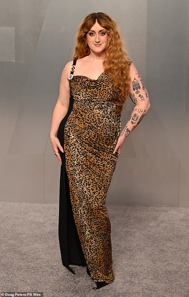 Social media personality Brittany Broski, 28, missed the mark as she arrived at the afterparty in a floor-length leopard-print gown that boasted gold buckle detailing on the straps, as she also sported an ICE OUT badge