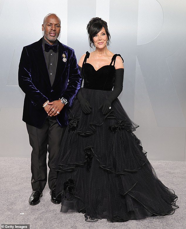 Kris Jenner, 70, who arrived with boyfriend Corey Gamble, appeared to channel Cruella de Vil in an all-black gown that boasted a layered tulle skirt and sweetheart neckline before finishing the look with a messy updo and excessively long gloves