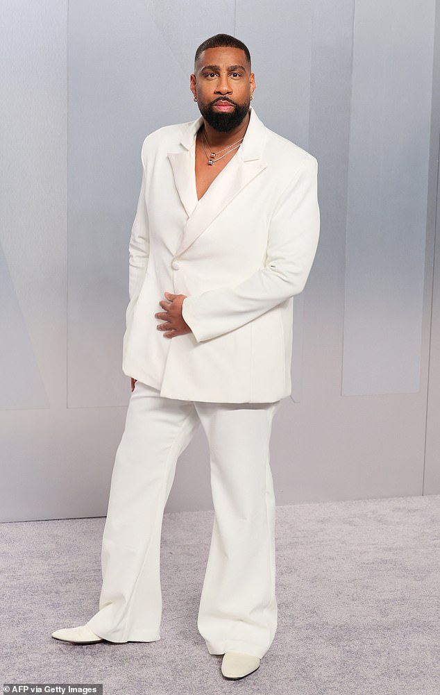 Stylist Micah McDonald made a rare fashion misstep in an all-white suit that appeared to be several sizes too big. He flashed a glimpse of his bare chest in the baggy ensemble, which he paired with white shoes