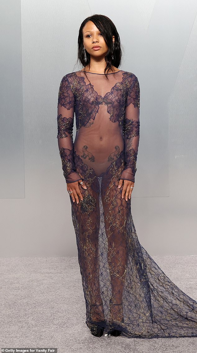 Myha'la Herrold left very little to the imagination in a sheer dress that offered a glimpse of her body art, under some strategic embroidery