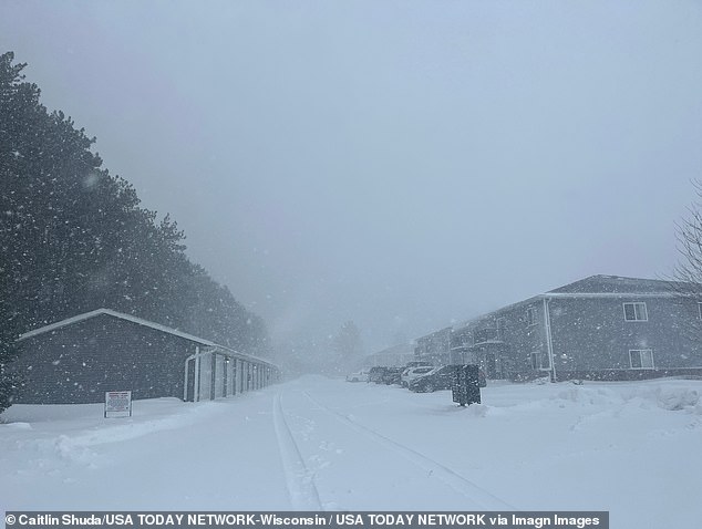 The northern portion of the storm has already dumped more than a foot of snow in parts of southern Minnesota and central Wisconsin, with more expected to come. Snowfall in Wisconsin Rapids is pictured on Sunday