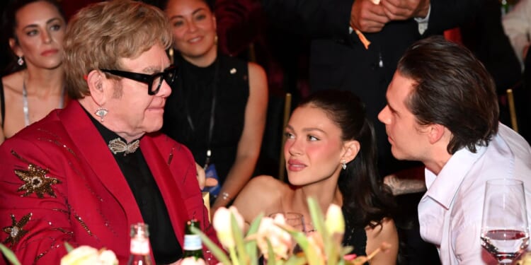 Brooklyn Beckham reunites with godfather Elton John alongside wife Nicola amid nasty feud with parents David & Victoria