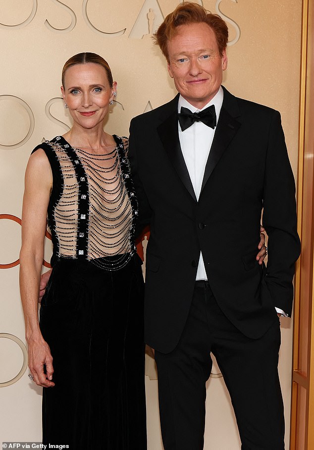 Returning Oscars host Conan O'Brien, 62, was upstaged on the red carpet by his wife Liza Powel O'Brien, 55, whose ensemble was certain to attract attention