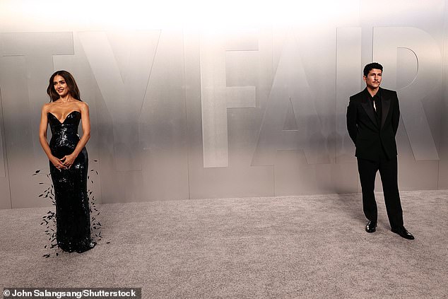 Alba posed at a distance from her new boyfriend, Danny Ramirez