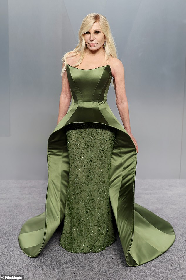 Donatella Versace worked her magic in a dramatic emerald green gown