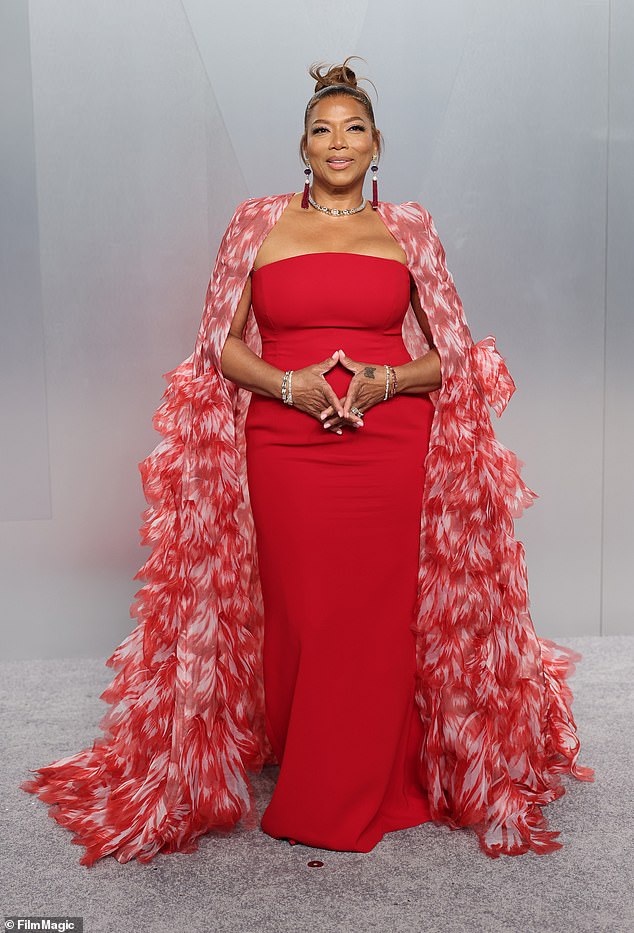 Queen Latifah ruled the red carpet in a stunning red gown with coordinating shawl
