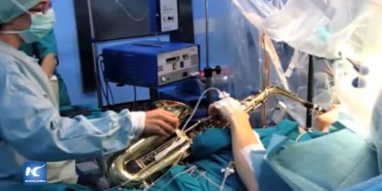 Musician who played saxophone during 12-hour brain tumour op dies aged 38 as tributes paid to 'shining example'