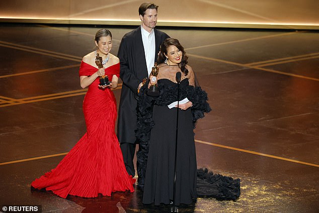 KPop Demon Hunters earned Best Animated Feature Film (Maggie Kang, Chris Appelhans and Michelle L.M. Wong are seen left to right) and Best Original Song for Golden