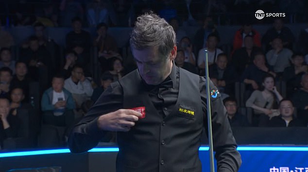 The seven-time world champion was repeatedly troubled by one of the logos on his waistcoat