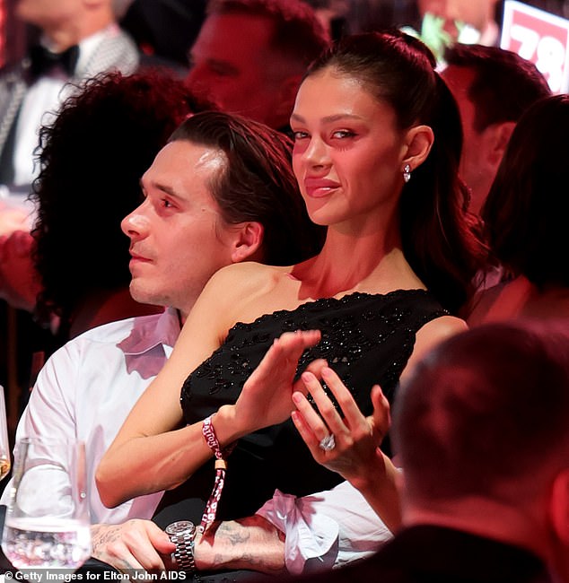 Brooklyn could not take his hands off his wife at the party