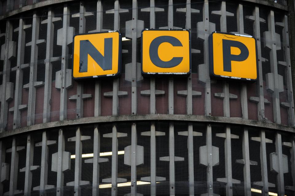 NCP (National Car Parks) sign logo on the side of a building.
