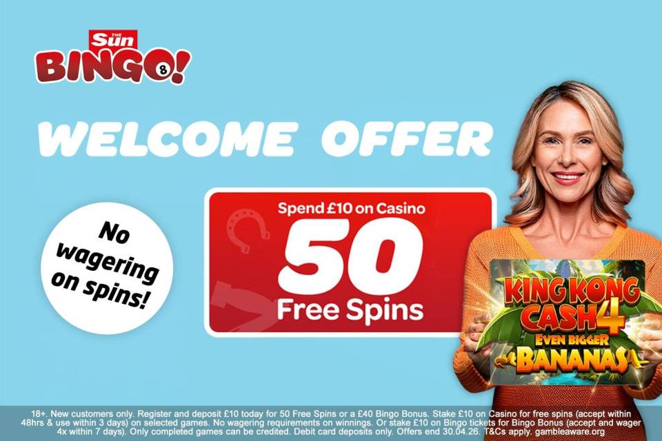 A woman holds a "King Kong Cash" game card next to an offer for 50 free casino spins for spending £10.