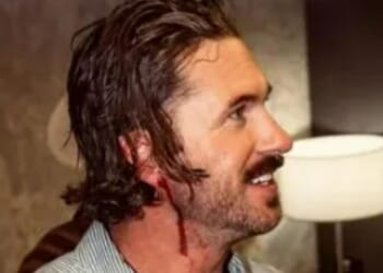 Watch moment huge country star kicks 'jealous boyfriend' out of his show after he's hit with a phone and left BLEEDING