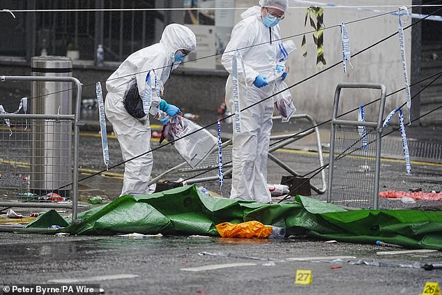 Forensic officers at the scene in Liverpool in May after Doyle ploughed his car into the crowd