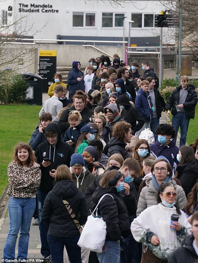 Students queue at the University of Kent in Canterbury today amid the meningitis outbreak