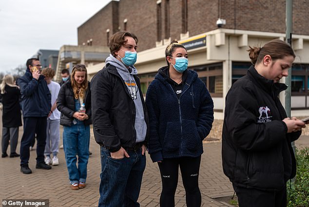 Students queue at the University of Kent in Canterbury today amid the meningitis outbreak