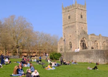 Woman is raped outside church in popular city centre park as man in his 30s is arrested & cops appeal for witnesses