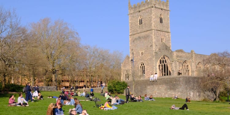 Woman is raped outside church in popular city centre park as man in his 30s is arrested & cops appeal for witnesses