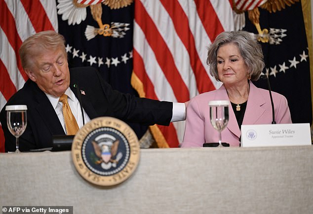 Trump made the remarks while sitting next to his closest adviser Susie Wiles - who was just diagnosed with 'early stage' breast cancer