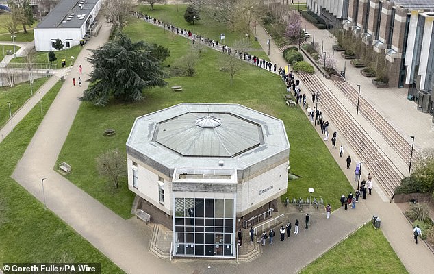 Students queuing for antibiotics outside a University of Kent building in Canterbury today